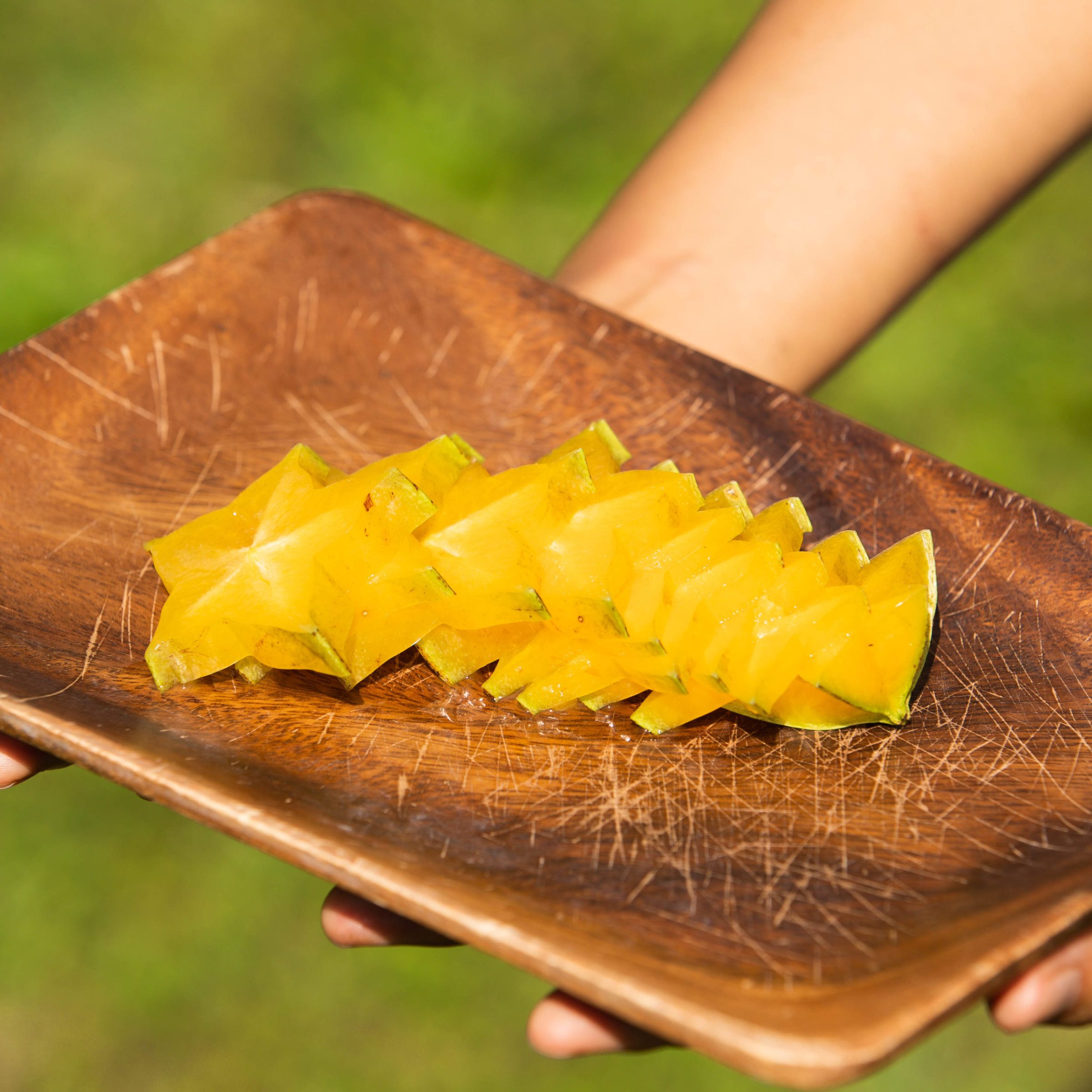 a close up of a person holding a piece of food