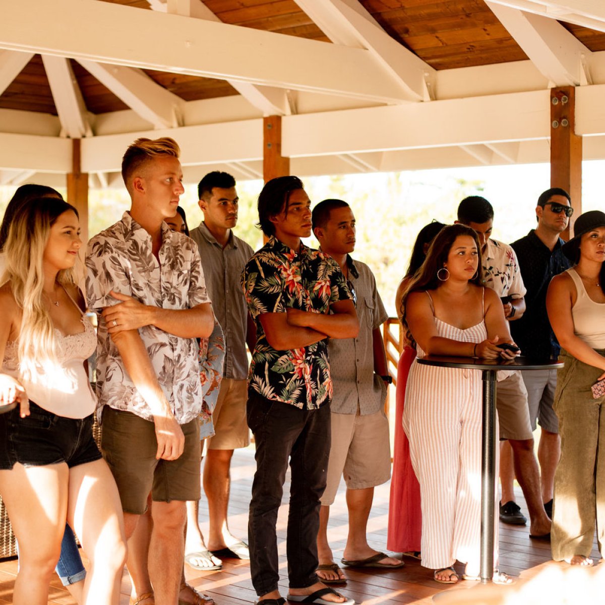 Valentine Holmes et al. standing in a room