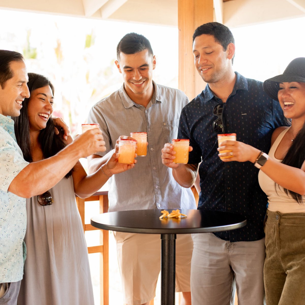 a group of people holding wine glasses